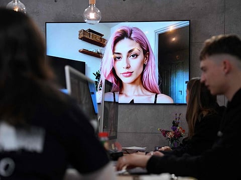 An artificial intelligence generated image of Aitana Lopez model displayed in a screen at the headquarters of The Clueless company in Barcelona. Described as "strong" and "determined" by Spanish advertising agency The Clueless which offers her services to promote various products, influencer Aitana is not a real person, but an image produced by AI, and a new rival on the influencers' market.