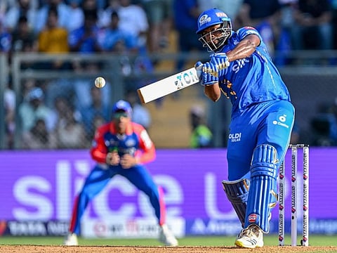 Mumbai Indians' Romario Shepherd sends one packing over the ropes during the Indian Premier League match against Delhi Capitals at the Wankhede Stadium in Mumbai on Sunday.