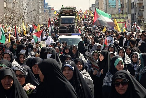 Iranians attend the funeral of seven Revolutionary Guard Corps members killed in a strike on the country's consular annex in Damascus, which Tehran blamed on Israel, on April 5, 2024, during their funeral procession in Tehran.