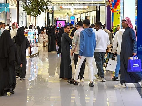 Residents of Mecca at a mall ahead of Eid.