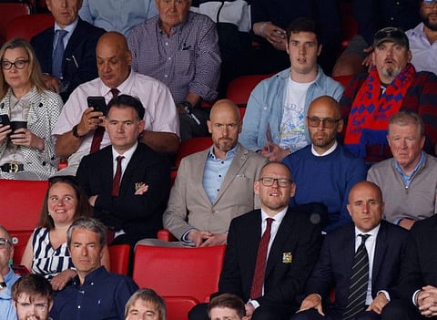 Manchester United manager Erik ten Hag, Mitchell van der Gaag, director of football John Murtough (left on middle row) and Steve McClaren in the stands.