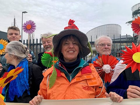 People stand in support of the Senior Women for Climate Protection in front of the European Court of Human Rights in Strasbourg.