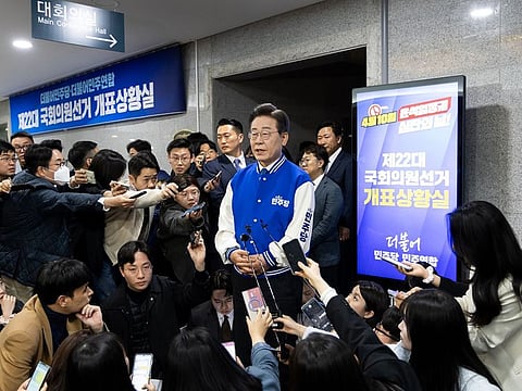 Lee Jae-myung, leader of the Democratic Party, centre, speaks to the media at the party's office in the National Assembly in Seoul, South Korea, on Wednesday, April 10, 2024.