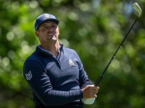 Bryson DeChambeau shot a second round 73 to remain at the summit of the leaderboard