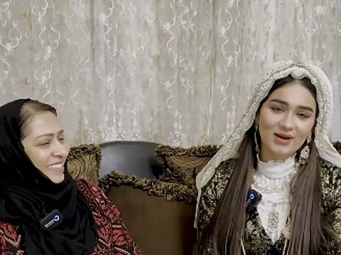 Ramzia (left) and her granddaughter wearing a traditional garb.