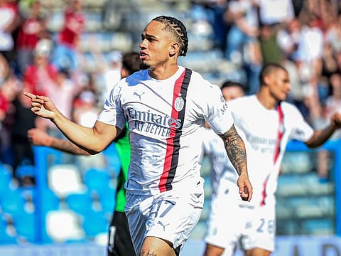 AC Milan's forward Noah Okafor celebrates scoring his team's third goal during the Italian Serie A match against Unione Sportiva Sassuolo at the Mapei Stadium in Reggio Emilia, on Sunday.