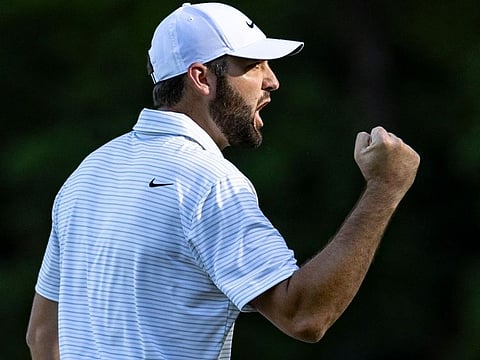 Scottie Scheffler celebrates his eagle at the 13th