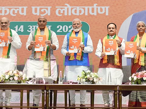 Modi releases the BJP election manifesto 'Sankalp Patra' at the party headquarters extension in New Delhi on Sunday. He is flanked by federal Home Minister Amit Shah, Defence Minister Rajnath Singh, Finance Minister Nirmala Sitharaman and party President JP Nadda.