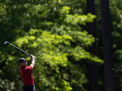 Tiger Woods dons his iconic red shirt during the final round of The Masters