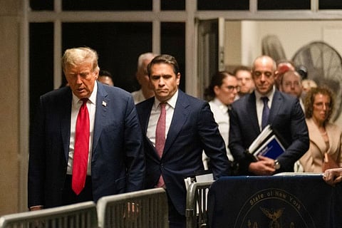 Former US President Donald Trump arrives to attend the first day of his trial for allegedly covering up hush money payments linked to extramarital affairs, at Manhattan Criminal Court in New York City on April 15, 2024.