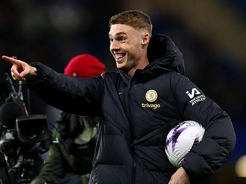 Chelsea's Cole Palmer celebrates with the match ball after winning 6-0 against Everton on Monday.
