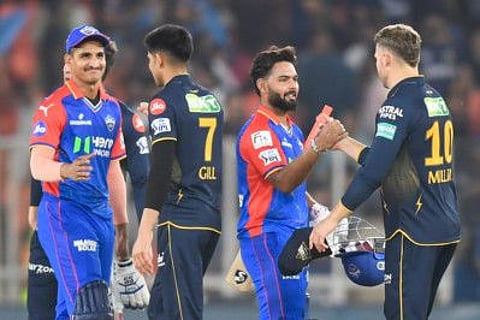 Gujarat Titans' captain Shubman Gill greets Delhi Capitals' players after their win at the end of Indian Premier League match at the Narendra Modi Stadium in Ahmedabad on Wednesday.
