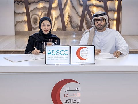 Mohammed Al Fahim, Deputy Secretary General of Support Services Sector at ERC and Dr Maysoon Al Karam, Chief Medical Officer of ADSCC, at the agreement signing ceremony in Abu Dhabi
