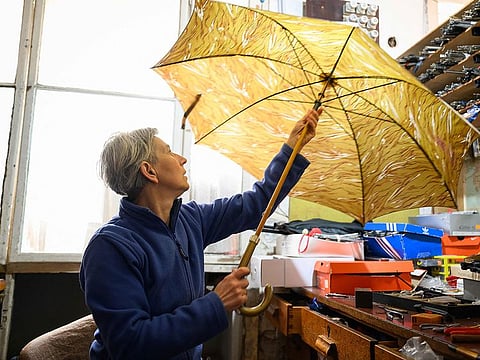 Marija Lah, one of Europe's last umbrella repairers in her workshop in Ljubljana.