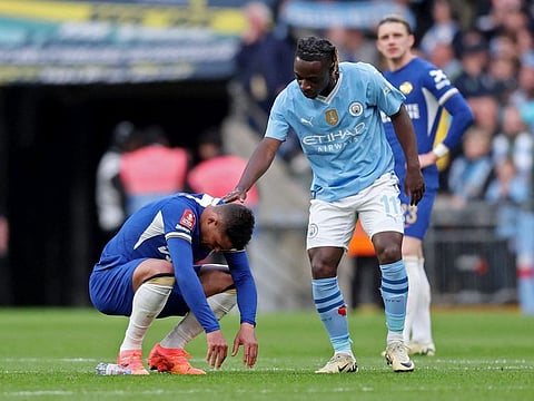 Chelsea's Thiago Silva looks dejected as Manchester City's Jeremy Doku looks on after the match.