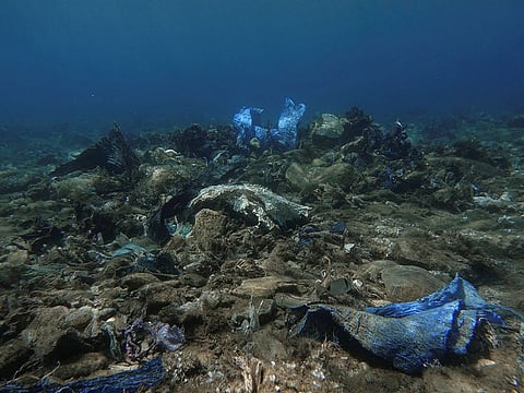 Plastic and other waste at the bottom of the sea, off the island of Andros, Greece.