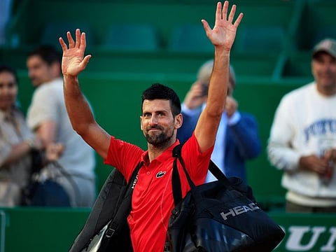 Serbia's Novak Djokovic gestures to the public as he leaves the court at the end of his Monte Carlo ATP Masters Series Tournament at the Monte Carlo Country Club on April 13.