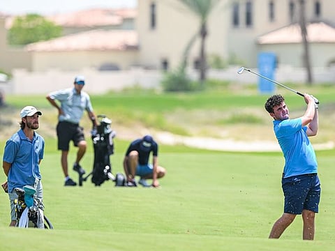 Fleetwood keeps a close eye on Craig during a practice round ahead of the UAE Challenge