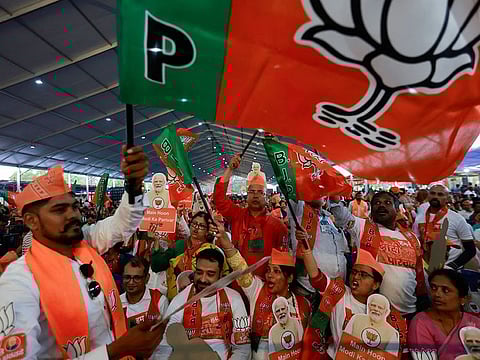 Supporters of India's ruling Bharatiya Janata Party (BJP) shout slogans during an election campaign where Prime Minister Narendra Modi speaks, in Bengaluru, Karnataka, India, April 20, 2024.