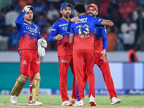 Royal Challengers Bengaluru's Virat Kohli (right) and his teammates celebrate their team's win against Sunrisers Hyderabad in the Indian Premier League match at the Rajiv Gandhi International Stadium in Hyderabad on Thursday.