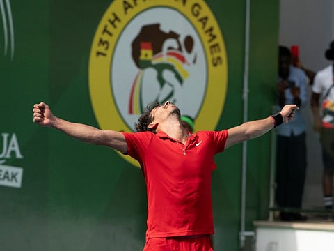 Tunisia's Moez Echargui reacts after winning the African Games in Accra, Ghana.