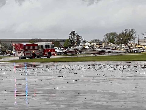 Emergency personnel work next to the damages caused by a tornado at Eppley Airfield, in Omaha, Nebraska, U.S. April 26, 2024, in this still image obtained from a social media video