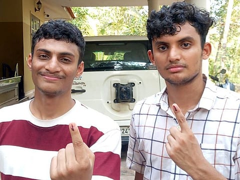 Brothers Mohammed Rifad Thayyil (left) and Abdul Rahoof Thayyil after casting their votes on Friday.