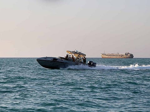 Yemeni coastguards ride in a patrol boat in the Red Sea off the government-held town of Mokha in the western Taiz province