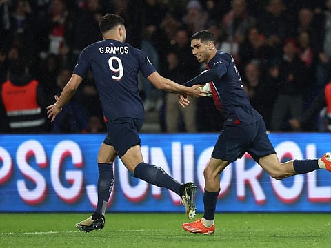 Paris Saint-Germain's defender Achraf Hakimi (right) celebrates with Goncalo Ramos after scoring a goal during the match against Le Havre AC at the Parc des Princes Stadium in Paris on Saturday.