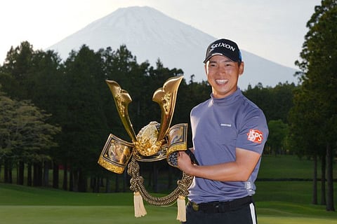 Japan's Yuto Katsuragawa celebrates winning the ISPS Handa Championship Japan in Gotemba of Shizuoka Prefecture on Sunday.