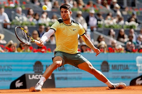 Spain's Carlos Alcaraz returns the ball to Brazil's Thiago Seyboth Wild during the third round of the 2024 ATP Tour Madrid Open tournament in Madrid on Sunday.