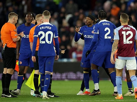Chelsea's Noni Madueke remonstrates with referee Craig Pawson during a Premier League against Aston Villa at Villa Park, Birmingham on Saturday.