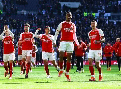 Arsenal's Gabriel and Jakub Kiwior celebrate after their win against Tottenham Hotspur during the Premier League at Tottenham Hotspur Stadium, London, on Sunday.