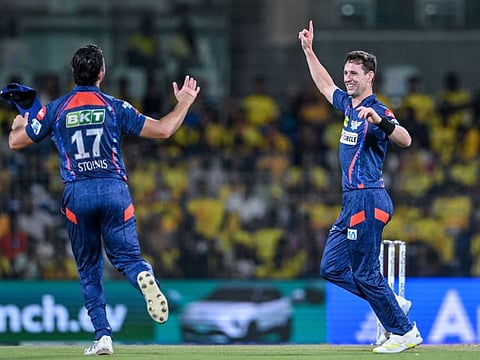 Lucknow Super Giants' Matt Henry celebrates with his teammate Marcus Stoinis after taking the wicket of Chennai Super Kings' Ajinkya Rahane during the Indian Premier League at the MA Chidambaram Stadium in Chennai on April 23.