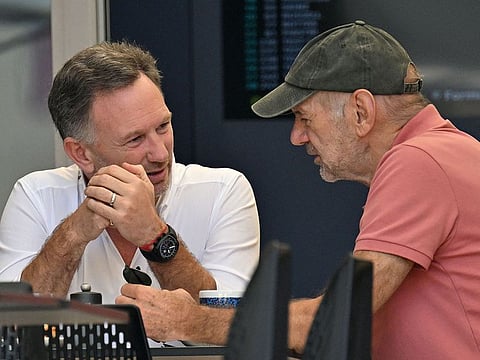 Red Bull Racing's team principal Christian Horner (L) talks to Red Bull Racing's team technical chief Adrian Newey during the second day of the Formula One pre-season testing at the Bahrain International Circuit in Sakhir on February 22, 2024.