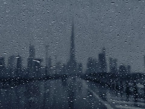 Artwork of Dubai skyline in rain, shared on X by Dubai Municipality
