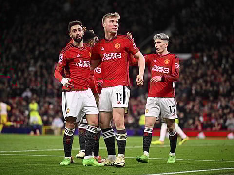 Manchester United's Rasmus Hojlund (centre) celebrates scoring the team's fourth goal during the English Premier League football match against Sheffield United at Old Trafford in Manchester, north west England, on April 24.
