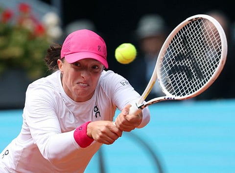 Poland's Iga Swiatek returns the ball to US' Madison Keys during the 2024 WTA Tour Madrid Open tournament semi-final tennis match at Caja Magica in Madrid on Thursday.