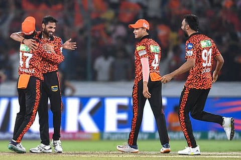 Sunrisers Hyderabad's Bhuvneshwar Kumar and his teammates celebrate after their team's win in the Indian Premier League Twenty20 cricket match against Rajasthan Royals at the Rajiv Gandhi International Stadium in Hyderabad on Thursday.