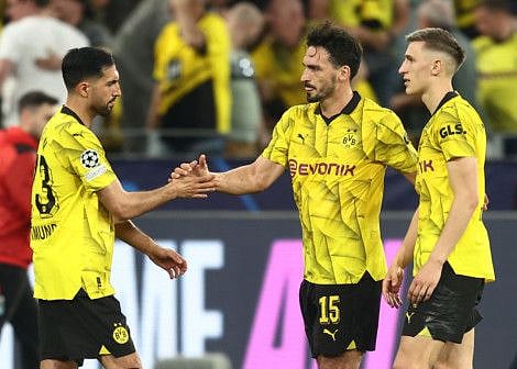 Borussia Dortmund's Emre Can, Mats Hummels and Nico Schlotterbeck celebrate after the Champions League semi-final first leg match against Paris St Germain Signal Iduna Park, Dortmund, on Wednesday.