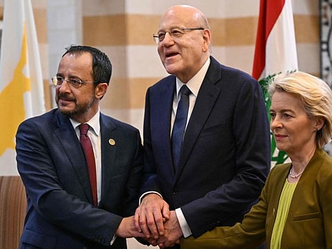 Lebanon's Prime Minister Najib Mikati (centre) poses for a picture with European Commission President Ursula von der Leyen and Cypriot President Nikos Christodoulides during their meeting at the Grand Serail government headquarters in Beirut on May 2, 2024.