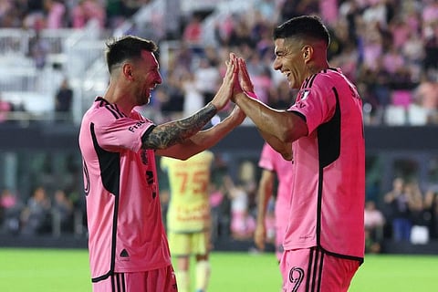 Luis Suarez of Inter Miami CF celebrates with Lionel Messi after scoring his third goal against the New York Red Bulls at DRV PNK Stadium in Fort Lauderdale, Florida on Saturday.