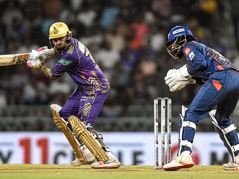 Kolkata Knight Riders' Sunil Narine in action as Lucknow Super Giants' wicktkeeper and captain KL Rahul watches during the Indian Premier League (IPL) Twenty20 cricket match at the Ekana Cricket Stadium in Lucknow on Sunday.