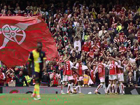 Arsenal's Declan Rice celebrates scoring their third goal with teammates during a Premier League match against AFC Bournemouth at Emirates Stadium, London, on Saturday.