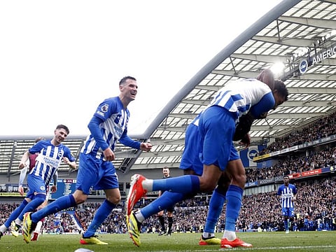 Brighton & Hove Albion's Joao Pedro celebrates scoring their first goal with Billy Gilmour and Pascal Gross during their Premier League match against Aston Villa at The American Express Community Stadium, Brighton, on Sunday.