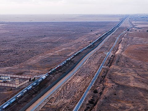 A drone picture of a line of trucks waiting on an Egyptian road along the border with Israel, near the Rafah border crossing with the Gaza Strip.