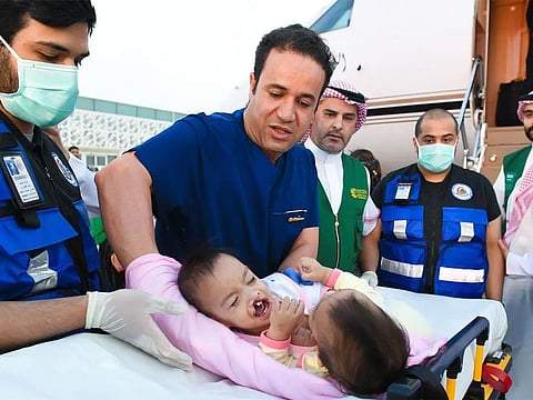 Conjoined twins Akhizah and Ayeesha Yosoph touched down in Riyadh on Sunday aboard a Saudi evacuation flight coordinated by the Ministry of Health.
