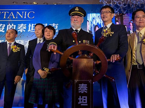 Bernard Hill (3rd R), actor of captain Edward Smith in the 1997 Titanic movie, poses with Su Shaojun (2nd R), CEO of Seven-Star Energy Investment Group (SSEG), during a news conference in Hong Kong January 12, 2014.