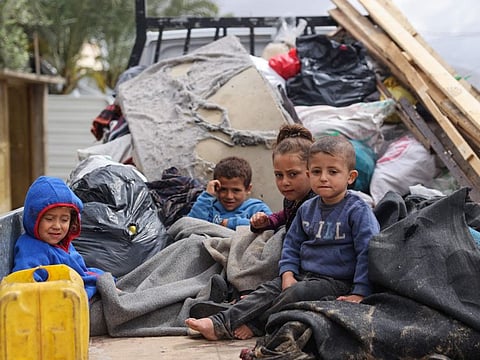 Displaced Palestinians in Rafah in the southern Gaza Strip pack their belongings following an evacuation order by the Israeli army on May 6, 2024.