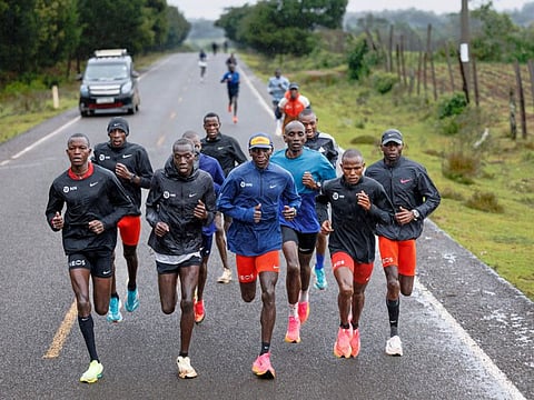 Olympic marathon champion, Eliud Kipchoge (centre) runs among his pacers during a fartlek (speed work) session in Kaptagat on May 4.